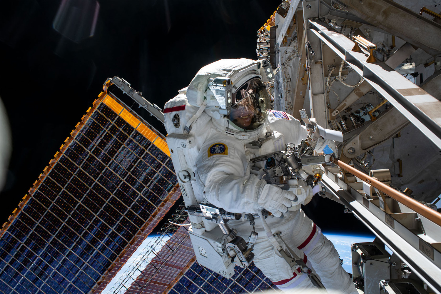 Astronaut floating in space outside of International Space Station